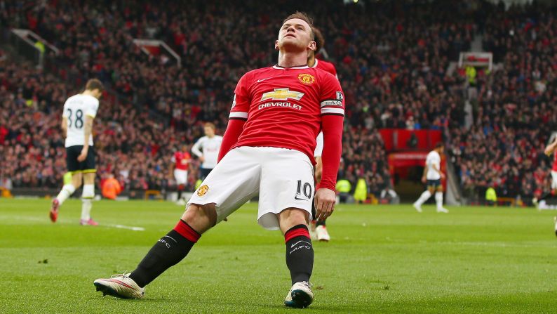 Manchester United captain Wayne Rooney falls backward as he celebrates a goal Sunday, March 15, in Manchester, England. Rooney <a href="index.php?page=&url=http%3A%2F%2Fwww.cnn.com%2F2015%2F03%2F15%2Ffootball%2Ffootball-man-utd-tottenham-chelsea%2F" target="_blank">was making light of a viral video</a> that showed him getting knocked down while playfully boxing in his home.