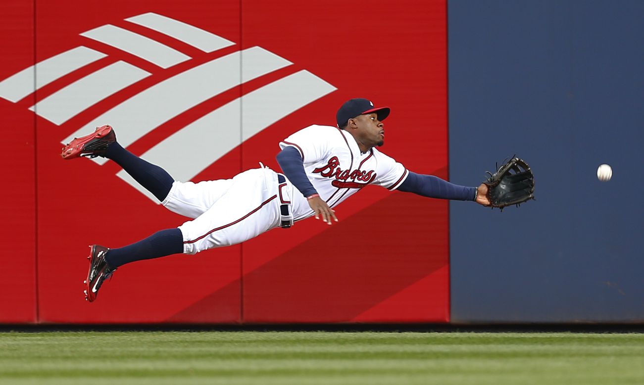 Atlanta center fielder Eric Young Jr. dives for a ball during a home game against Washington on Monday, April 27.