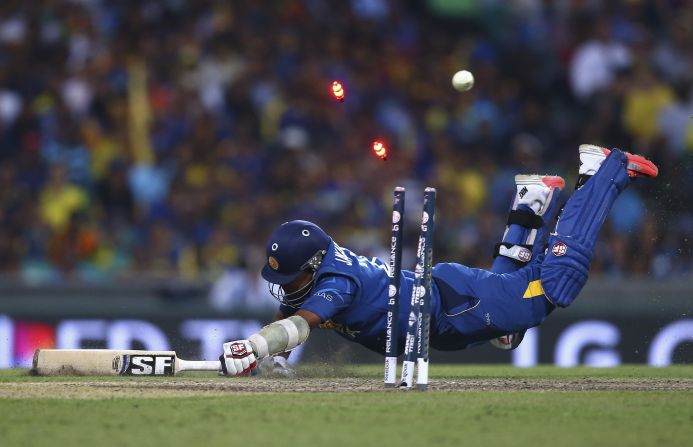 Mahela Jayawardene of Sri Lanka is run out by Michael Clarke of Australia during a Cricket World Cup match Sunday, March 8, in Sydney. Australia won the match by 64 runs and <a href="index.php?page=&url=http%3A%2F%2Fwww.cnn.com%2F2015%2F03%2F29%2Fsport%2Fcricket-world-cup-final-australia%2F" target="_blank">went on to win the tournament.</a>