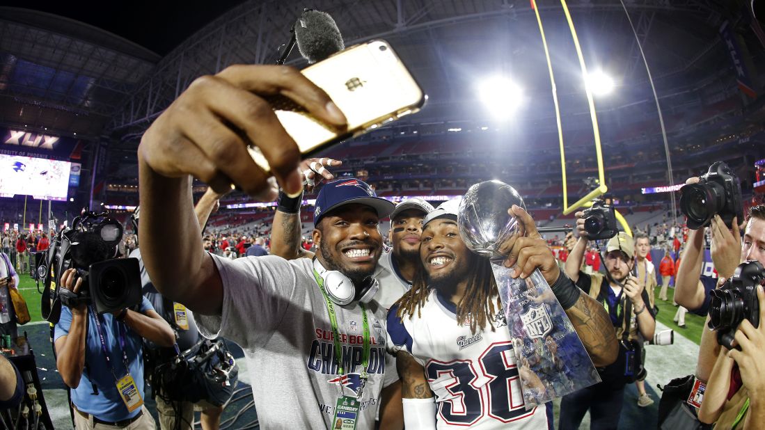 New England Patriots running back Brandon Bolden holds the Vince Lombardi Trophy as he and teammates celebrate winning <a href="http://www.cnn.com/2015/02/01/us/gallery/super-bowl-xlix/index.html" target="_blank">Super Bowl XLIX</a> on Sunday, February 1. The Patriots defeated the Seattle Seahawks 28-24 in Glendale, Arizona.