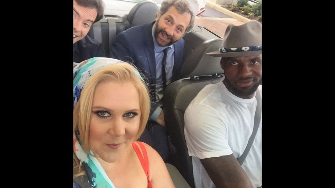 Comedian Amy Schumer rides shotgun with basketball star LeBron James on Friday, July 10. Behind them, from left, are "Trainwreck" co-star Bill Hader and the film's director, Judd Apatow. "Just a ride," <a href="https://instagram.com/p/4-j-J4KUND/" target="_blank" target="_blank">Schumer said on Instagram.</a> They were shooting a skit for "Funny or Die."