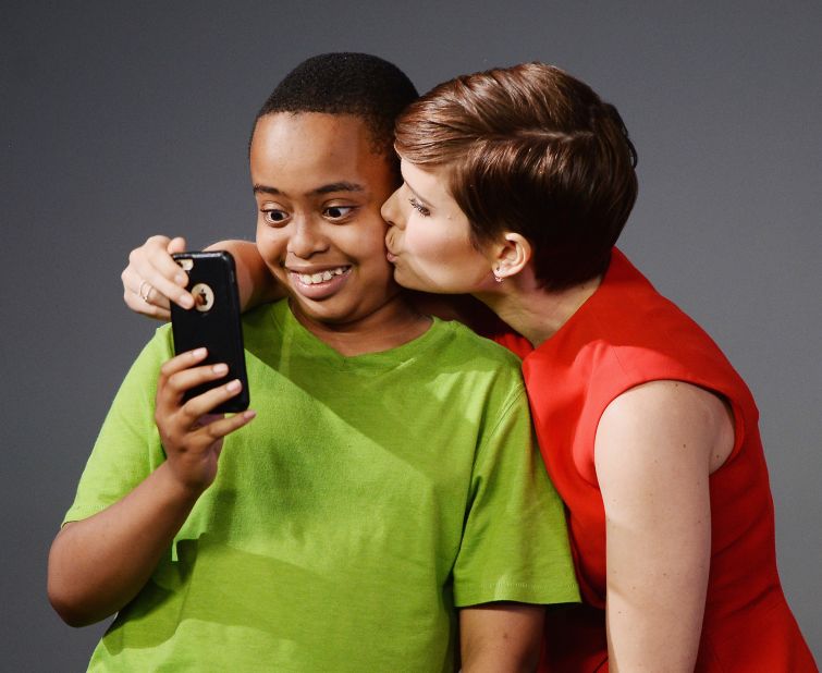 Actress Kate Mara kisses a fan at an Apple store in New York City on Monday, August 3. Mara and the rest of the "Fantastic Four" cast were at the store to help promote the movie.