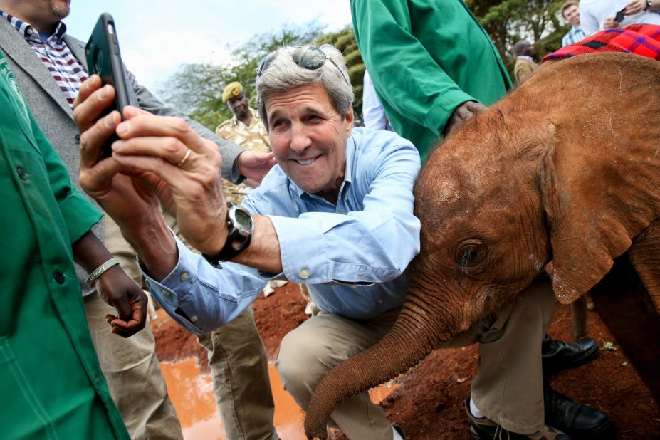 U.S. Secretary of State John Kerry takes a selfie with a baby elephant Sunday, May 3, while touring an elephant orphanage in Nairobi, Kenya.