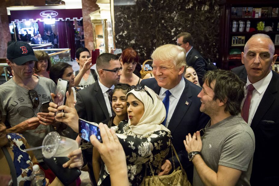Republican presidential candidate Donald Trump poses for a selfie after a television interview in New York on Wednesday, August 26.