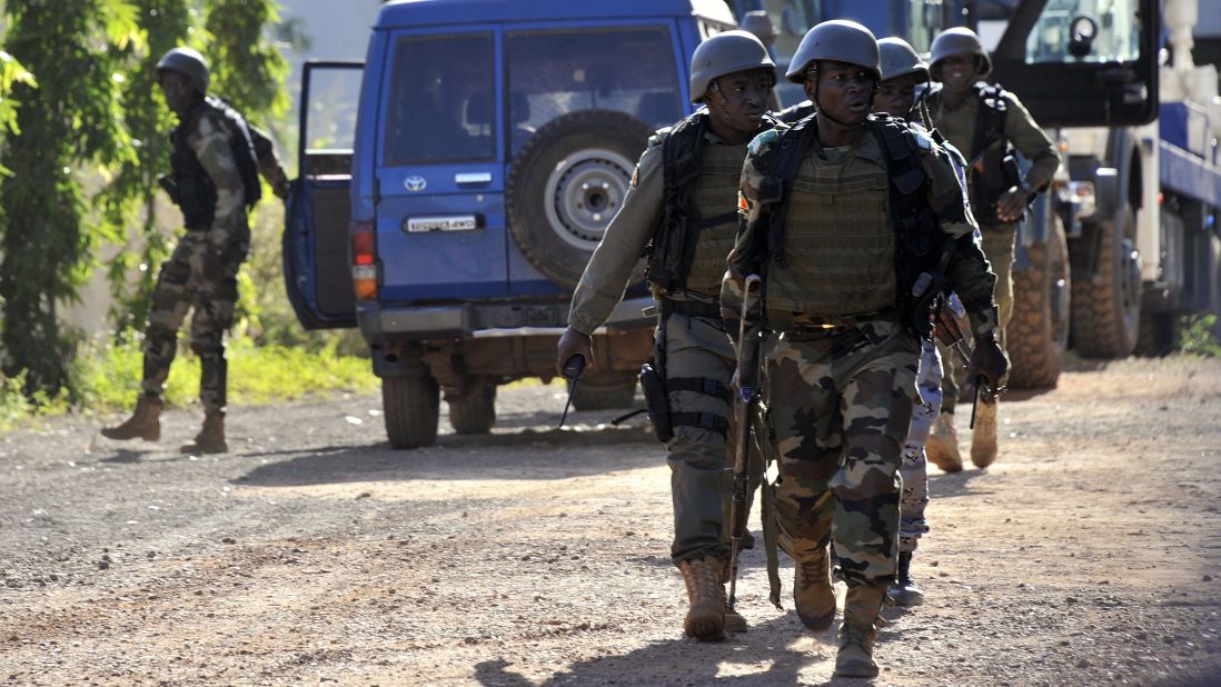 Malian troops arrive at the scene on November 20.
