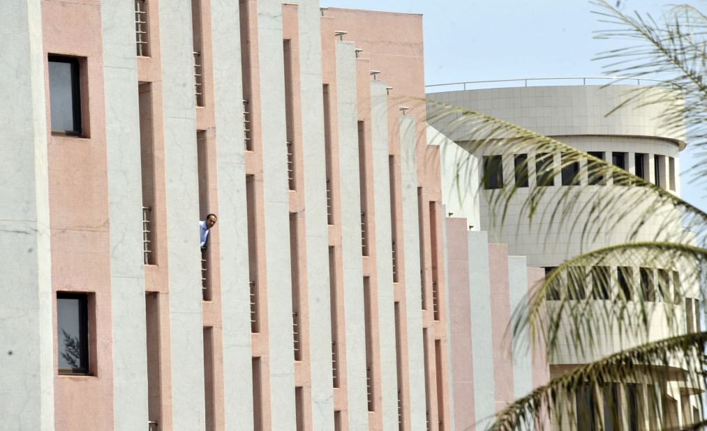 A man looks out a window at the hotel on November 20.