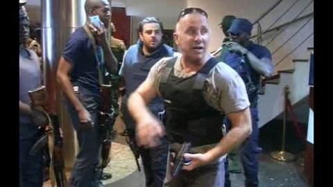 In this screengrab from the country's state broadcaster, ORTM, an officer gives instructions to security forces inside the hotel on November 20.