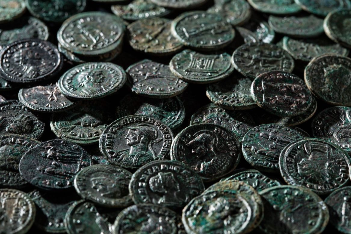The coins, made of bronze and silver, were buried for 1,700 years, dating from the 3rd century.