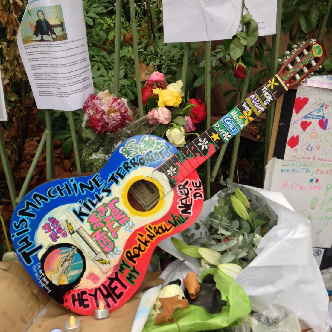 Makeshift memorials have popped up outside the Bataclan to honor those killed and wounded inside.