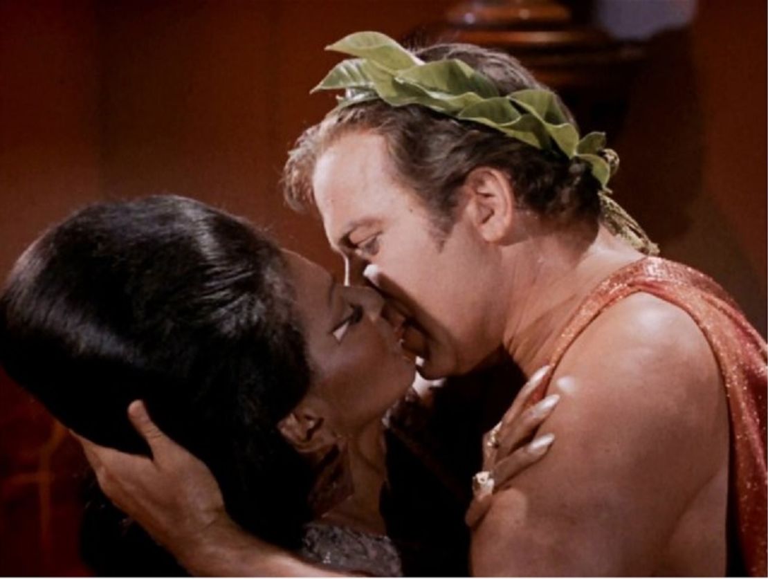 Nichelle Nichols and William Shatner embrace in what is widely credited as America's first interracial kiss on TV.