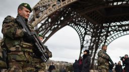 PARIS, FRANCE - JANUARY 12:  French troops patrol around the Eifel Tower on January 12, 2015 in Paris, France. France is set to deploy 10,000 troops to boost security following last week's deadly attacks while also mobilizing thousands of police to patrol Jewish schools and synagogues.  (Photo by Jeff J Mitchell/Getty Images)