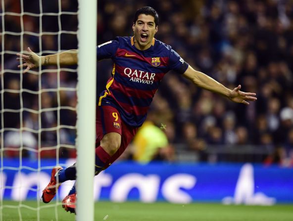 Luis Suarez celebrates after opening the scoring for Barcelona against Real Madrid.