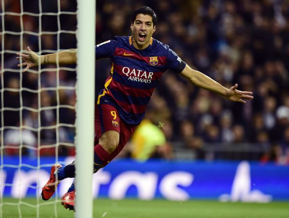 Luis Suarez celebrates after opening the scoring for Barcelona against Real Madrid.
