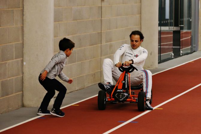 Williams driver Felipe Massa brought his son Felipinho on the boys' weekend in London and takes time out to show him his go-karting skills at the Olympic Stadium.