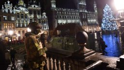 A Belgian soldier stands guard around a security perimeter as a reported police intervention takes place around the Grand Place central square in Brussels on November 22, 2015. Brussels will remain at the highest possible alert level with schools and metros closed over a "serious and imminent" security threat in the wake of the Paris attacks, the Belgian prime minister said. AFP PHOTO / EMMANUEL DUNAND        (Photo credit should read EMMANUEL DUNAND/AFP/Getty Images)