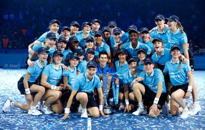 Serbia's Djokovic gives the ball boys a treat after claiming the title in scintillating style.
