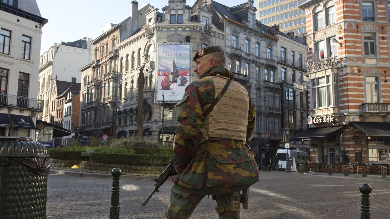 A Belgian Army soldier patrols in the Sablon District of Brussels on Monday, Nov. 23, 2015. The Belgian capital Brussels has entered its third day of lockdown, with schools and underground transport shut and more than 1,000 security personnel deployed across the country. (AP Photo/Virginia Mayo)