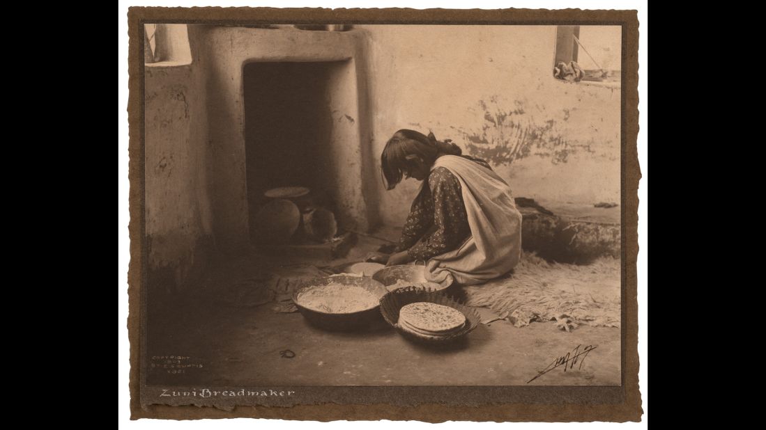 Someone from the Zuni tribe makes bread circa 1903.