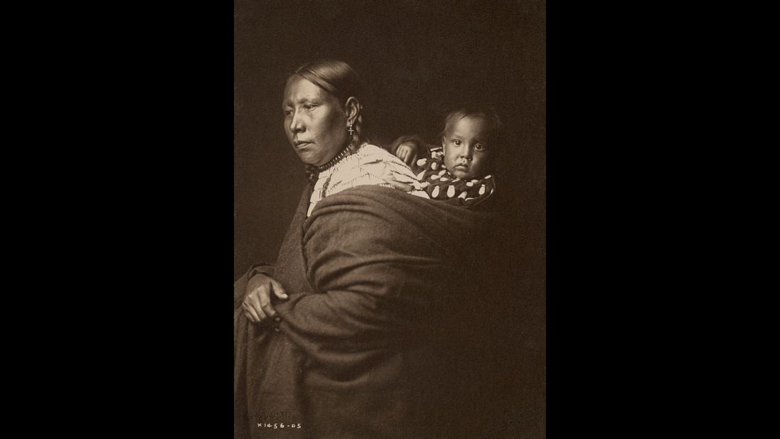 A Sioux mother and her child, circa 1905.