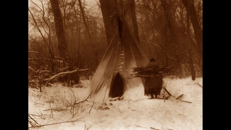 Someone from the Apsaroke tribe makes winter preparations in 1908.