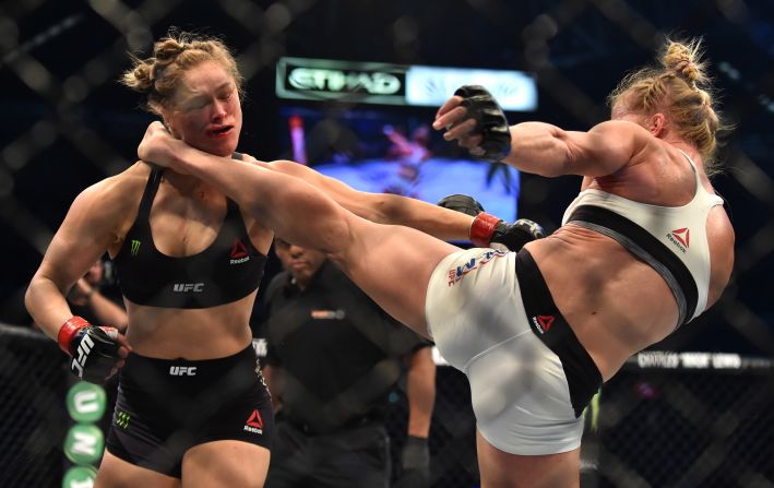 Holly Holm delivers a knockout kick to Ronda Rousey during their UFC title fight Sunday, November 15, in Melbourne. Holm finished the heavily favored Rousey in the second round. It was the first defeat of Rousey's career.