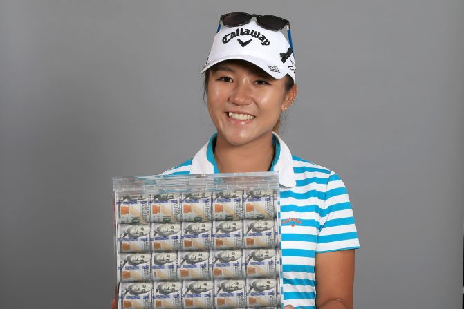 Lydia Ko poses with a box of $1 million in cash -- her prize for winning the Race to the CME Globe. The teenager also scooped the LPGA Player of the Year award to cap off an outstanding weekend.