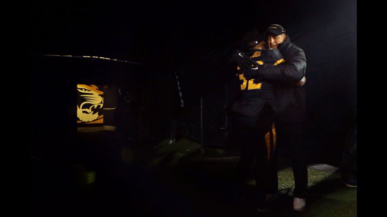 Missouri head coach Gary Pinkel embraces running back Russell Hansbrough before the start of a college football game in Columbia, Missouri, on Saturday, November 21. It was the final home game for Hansbrough, who is a senior, and for Pinkel, who is resigning because of his health. Pinkel was diagnosed with lymphoma earlier this year. <a href="index.php?page=&url=http%3A%2F%2Fwww.cnn.com%2F2015%2F11%2F17%2Fsport%2Fgallery%2Fwhat-a-shot-sports-1117%2Findex.html" target="_blank">See 29 amazing sports photos from last week</a>