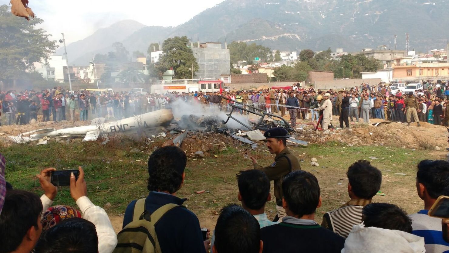 A crowd gathered at the scene of the deadly helicopter crash in Katra, Kashmir, on Monday. 