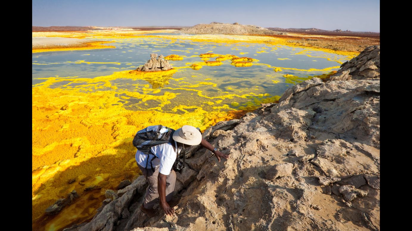 The Dallol hydrothermal field is northeast of the Erta Ale Range in one of the lowest and hottest areas of the desolate Danakil Depression in Ethiopia. The Dallol craters are the Earth's lowest known subaerial volcanic vents. Salty hot springs featuring a rich palette of colors dot the area. There are hot yellow sulphur fields among the white salt beds.