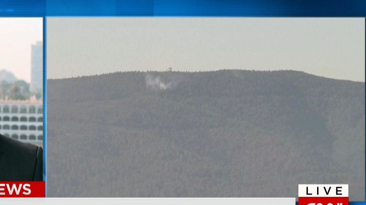 A Russian plane is seen crashing nose-first in northern Syria.