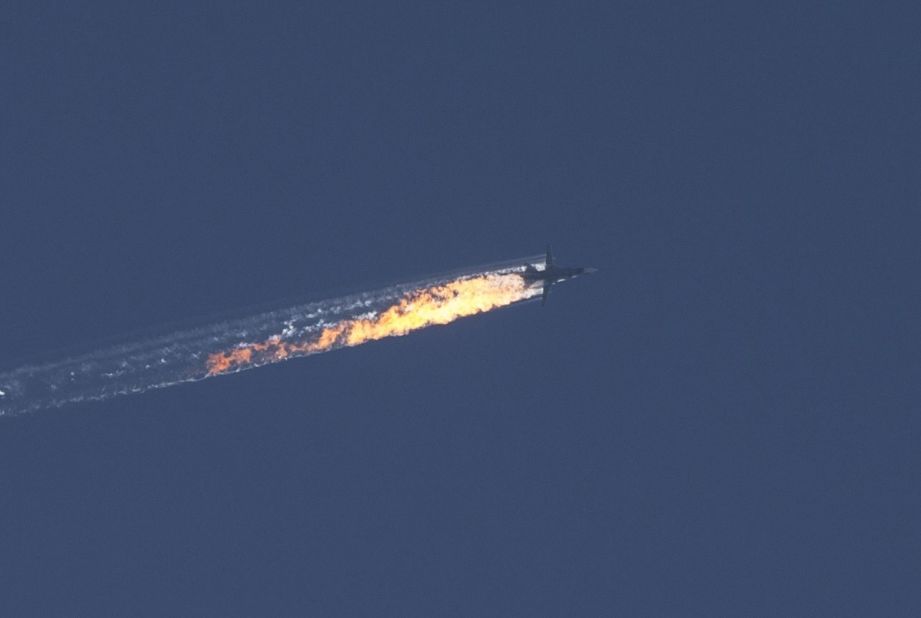 A Russian warplane goes down in Syria's Bayirbucak region, near the Turkish border, on November 24, 2015.