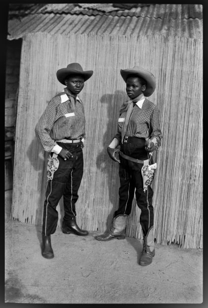 (Meta and Therese -- aka Roy.) The outfits of the Bills were largely sourced from Belgium, where family and friends overseas would mail hats, shirts and boots back to Congo. Whilst the vast majority of Bills were male, the gang Depara photographed, led by Andrada, had full female members, who played a full part in gang life -- and were every bit as tenacious in a fight.