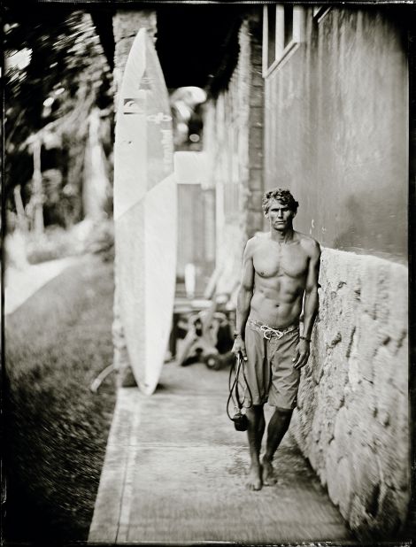 The Australian is one of 27 surfers invited to the 2015-16 Aikau event at Waimea Bay. For this image, he is leaning against the wall in order to keep still, as the wet-plate process requires subjects to pose in place for up to five seconds, says Testemale.  <br />"It's a really slow process because the sensitivity of the wet plate is really, really low, like one ISO (light sensitivity rating) or less. You cannot just click and get a picture, you have to be steady."
