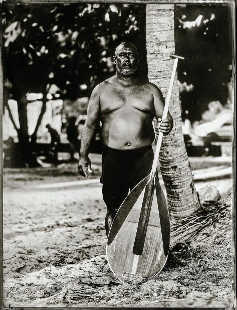 Testemale says the wet-plate development process is "quite fast -- you can see the photo coming to life in two or three minutes, like a polaroid." Another thing in common with the instant format is the photographs' distinctive borders.<br />Here he pictured Hawaiian canoe racer and lifeguard Mel Puu.<br />"He brought this paddle to Paris, he left it here in my house. I'm going to use it everywhere I go," Testemale says.