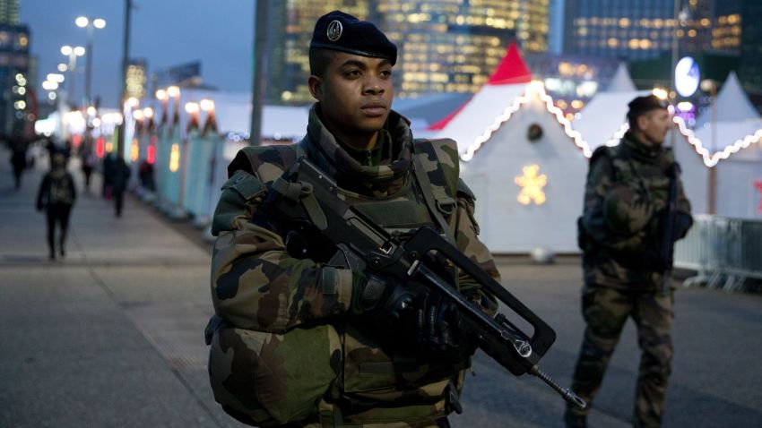 French soldiers patrol at Paris La Defense business district on November 24, 2015 as part of security measures set following November 13 Paris' terror attacks. AFP PHOTO / KENZO TRIBOUILLARD / AFP / KENZO TRIBOUILLARD        (Photo credit should read KENZO TRIBOUILLARD/AFP/Getty Images)