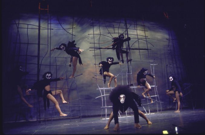 Dancers perform on stage.