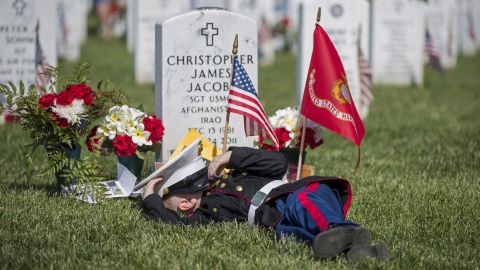 <strong>May 25:</strong> Christian Jacobs, 4, lies on the grave of his father, Christopher James Jacobs, during a <a href="http://www.cnn.com/2015/05/23/us/gallery/memorial-day-2015/index.html" target="_blank">Memorial Day</a> event at Arlington National Cemetery in Virginia.