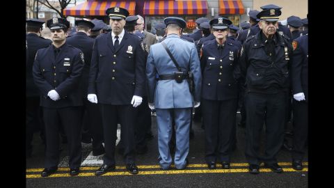 <strong>January 4: </strong>Law enforcement officers stand outside <a href="http://www.cnn.com/2015/01/04/us/gallery/liu-funeral/index.html" target="_blank">the funeral of fallen New York police officer Wenjian Liu.</a> Some officers turned their backs while New York Mayor Bill de Blasio spoke on a monitor. <a href="http://www.cnn.com/2014/12/22/politics/de-blasio-police-shooting/index.html" target="_blank">The mayor's critics</a> believed his comments after the death of Eric Garner contributed to an anti-police sentiment that led to the shootings of Liu and his partner, Rafael Ramos.