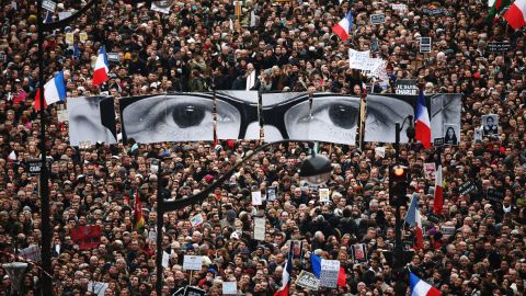 <strong>January 11:</strong> The eyes of Charlie Hebdo editor Stephane Charbonnier appear at <a href="http://www.cnn.com/2015/01/11/world/gallery/paris-unity-rally/index.html" target="_blank">an anti-terrorism rally in Paris.</a> More than a million people took part in the demonstration, a gesture of unity just days after Charbonnier and 16 others were slaughtered.