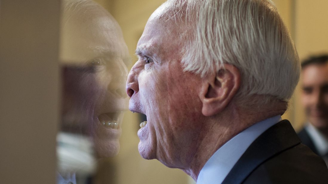<strong>January 13: </strong>U.S. Sen. John McCain fools around with colleagues upon arriving at a news conference in Washington.