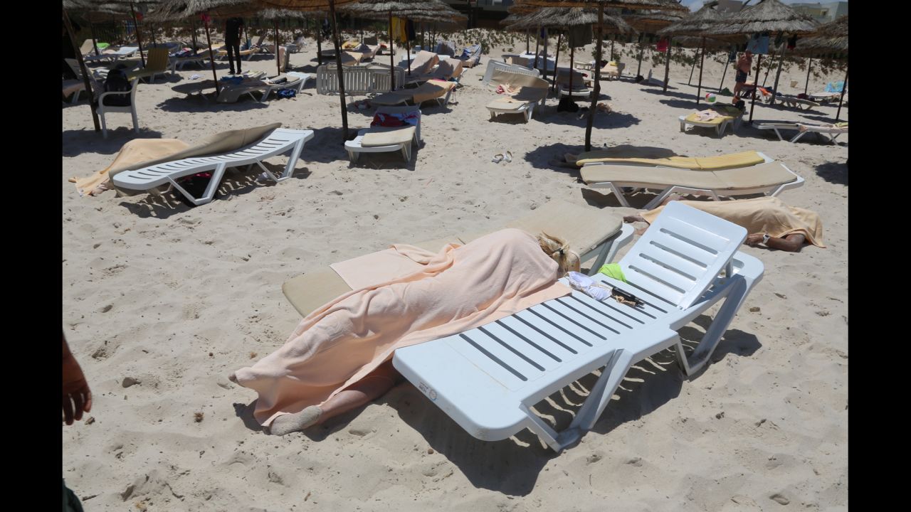 <strong>June 26:</strong> Dead bodies lie near a beachside hotel in Sousse, Tunisia, <a href="http://www.cnn.com/2015/06/26/world/gallery/tunisia-terrorist-attack/index.html" target="_blank">after a gunman opened fire.</a> At least 38 people were killed in the terrorist attack.