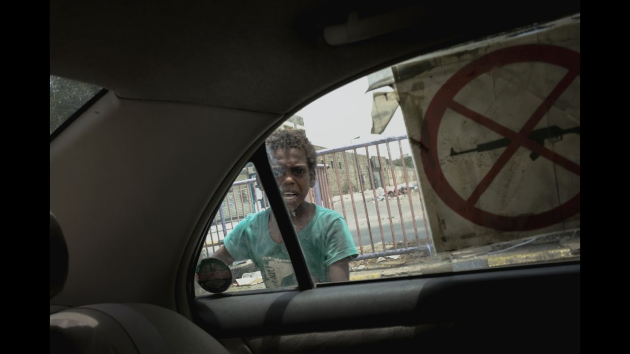 <strong>June 27:</strong> A child is seen through a car window in Aden, Yemen. The port city <a href="http://www.cnn.com/2015/07/30/world/cnnphotos-aden-yemen-besieged/index.html" target="_blank">has been under siege</a> since March, when Houthi rebels forced out President Abdu Rabu Mansour Hadi. "People in the city center have been shelled for a few months," photographer Guillaume Binet said.