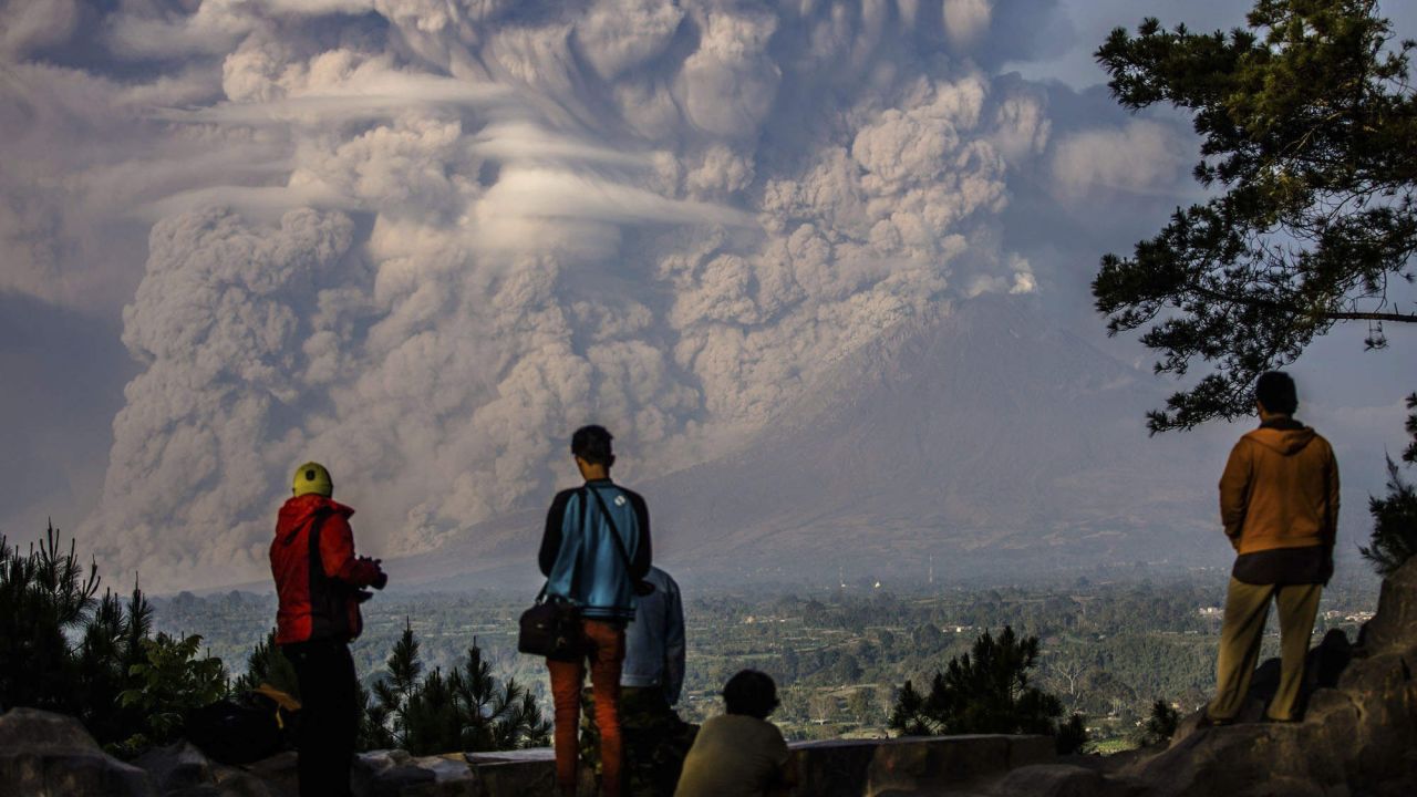 <strong>February 9:</strong> People watch as the Mount Sinabung volcano shoots ash into the air during an eruption in Karo, Indonesia. <a href="http://www.cnn.com/2013/11/20/world/gallery/recently-active-volcanos/index.html" target="_blank">See other recently active volcanoes</a>