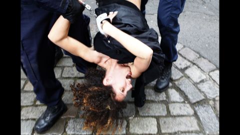 <strong>February 10:</strong> An activist from the Ukrainian feminist group Femen is arrested by police in Lille, France, after protesting in front of the convoy of Dominique Strauss-Kahn. Strauss-Kahn, the former chief of the International Monetary Fund, was on trial for aggravated pimping charges. <a href="http://www.cnn.com/2015/06/12/europe/france-strauss-kahn-verdict/" target="_blank">He was acquitted</a> in June.