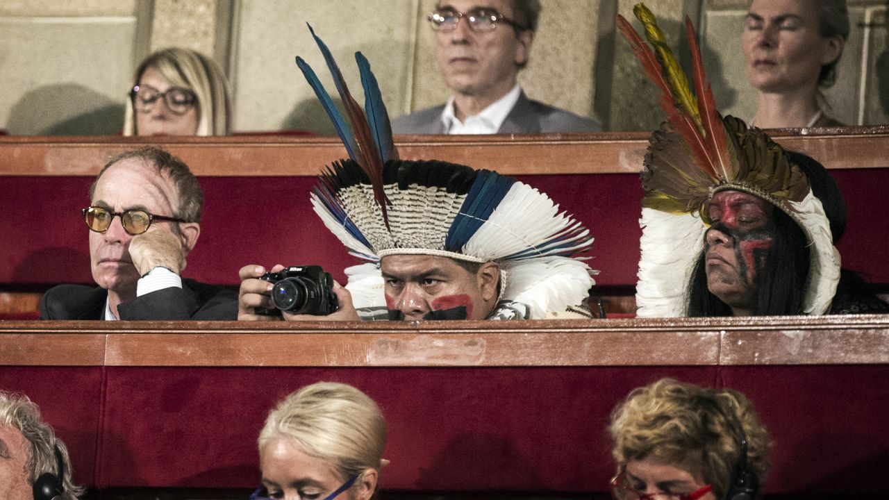 <strong>July 21:</strong> Delegates, some in traditional dress, attend the opening of a climate summit in Paris. French President Francois Hollande called for an ambitious accord ahead of a United Nations conference to address the threat of global warming.