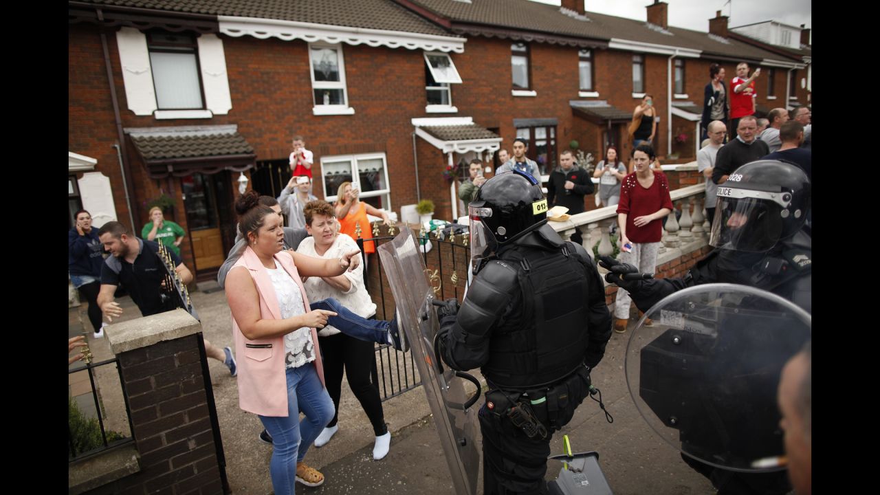 <strong>August 9: </strong>Riot police clear the streets in the Oldpark area of Belfast, Northern Ireland, after a controversial anti-internment rally was stopped by police.  