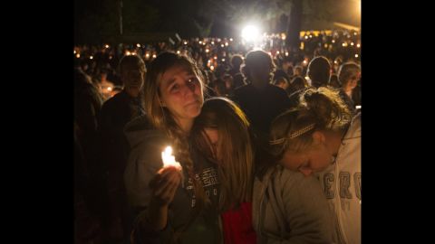 <strong>October 1: </strong>Community members attend a candlelight vigil for those killed during <a href="http://www.cnn.com/2015/10/01/us/gallery/oregon-shooting-umpqua-community-college/index.html" target="_blank">a shooting at Umpqua Community College</a> in Roseburg, Oregon. The massacre left nine people dead. The gunman, Chris Harper-Mercer, apparently committed suicide after exchanging gunfire with officers, a sheriff said.