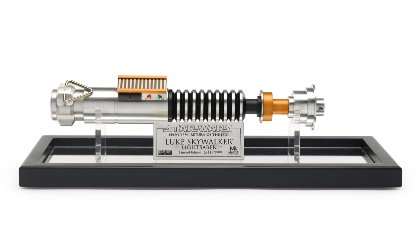 This replica of Luke's lightsaber from "Return of the Jedi" nevertheless went for big bucks. In the "Star Wars" canon the blade was constructed on Tatooine in a scene much mythologized by fans. Director Lucas and actor Mark Hamill long-denied that they'd ever shot such a scene, but in 2010 finally revealed in to the public at Star Wars Celebration V. It features as a bonus in the Blu Ray boxset. <br /><br /><br /><br /><br />STAR WARS RETURN OF THE JEDI LUKE SKYWALKER LIGHTSABER, MASTER REPLICAS, 2002<br />With case and plaque, limited edition 2454/2500<br />11 inches in length<br /><br />ESTIMATE  800 — 1,200  USD<br />