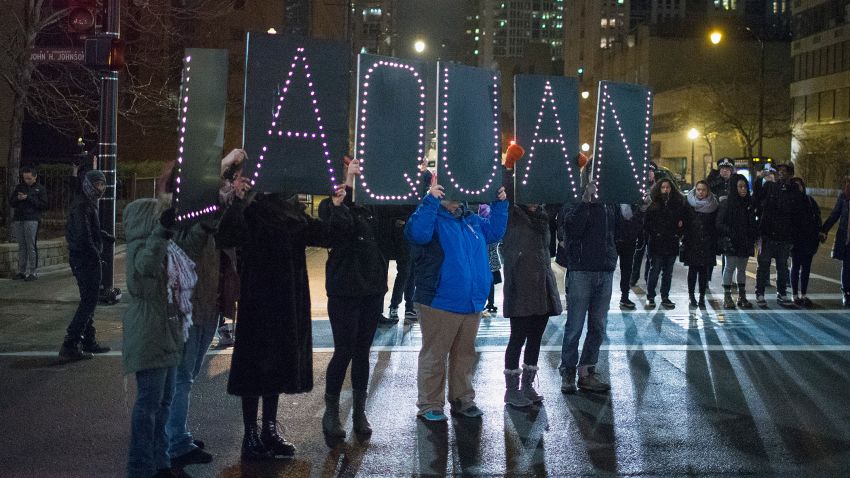 Demonstrators march through downtown following the release of a video showing Chicago Police officer Jason Van Dyke shooting and killing Laquan McDonald on November 24, 2015 in Chicago, Illinois.
