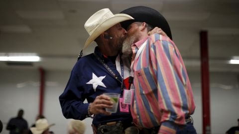 <strong>April 24:</strong> Gordon Satterly, left, kisses his husband, Richard Brand, at a party held in Little Rock, Arkansas, by the International Gay Rodeo Association. 